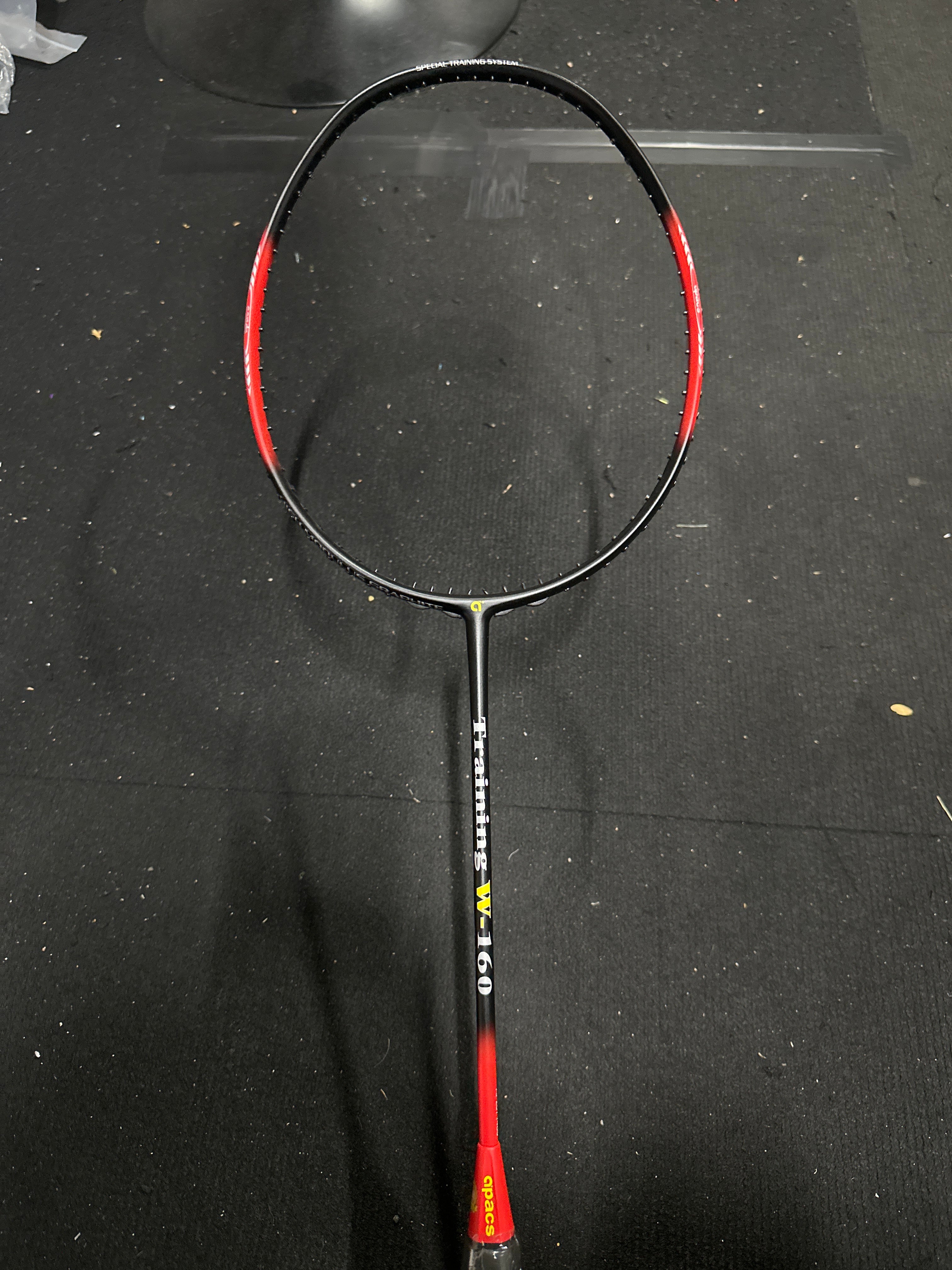 Badminton Training racket 160grams with 'Training W-160' label on a dark surface
